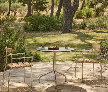 Table de repas ronde en inox poli et plateau en granit